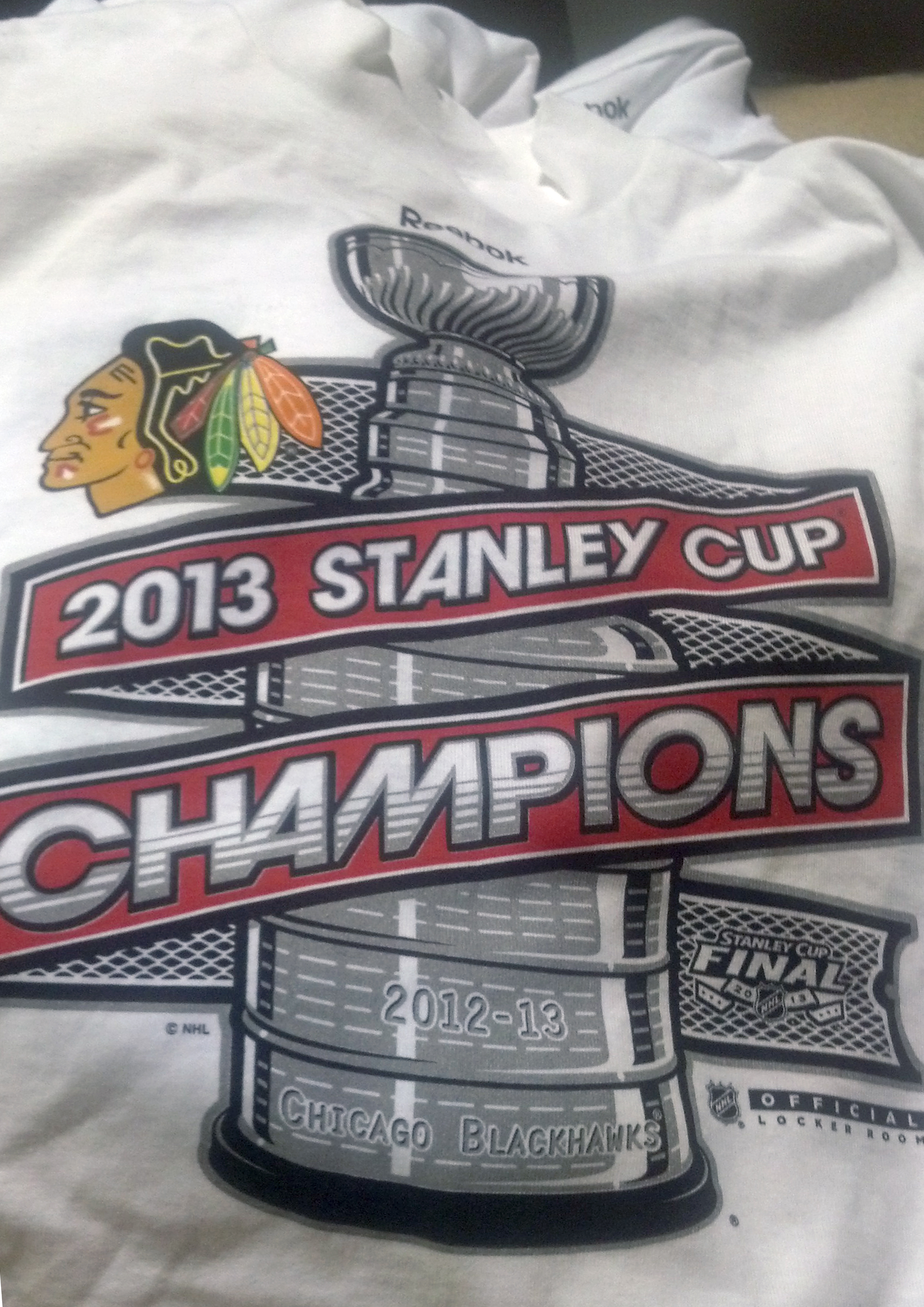 http://sobltd.com/blog/wp-content/uploads/2013/06/Blackhawks-Stanley-Cup-Champions-2013-Reebok-Shirt.jpg